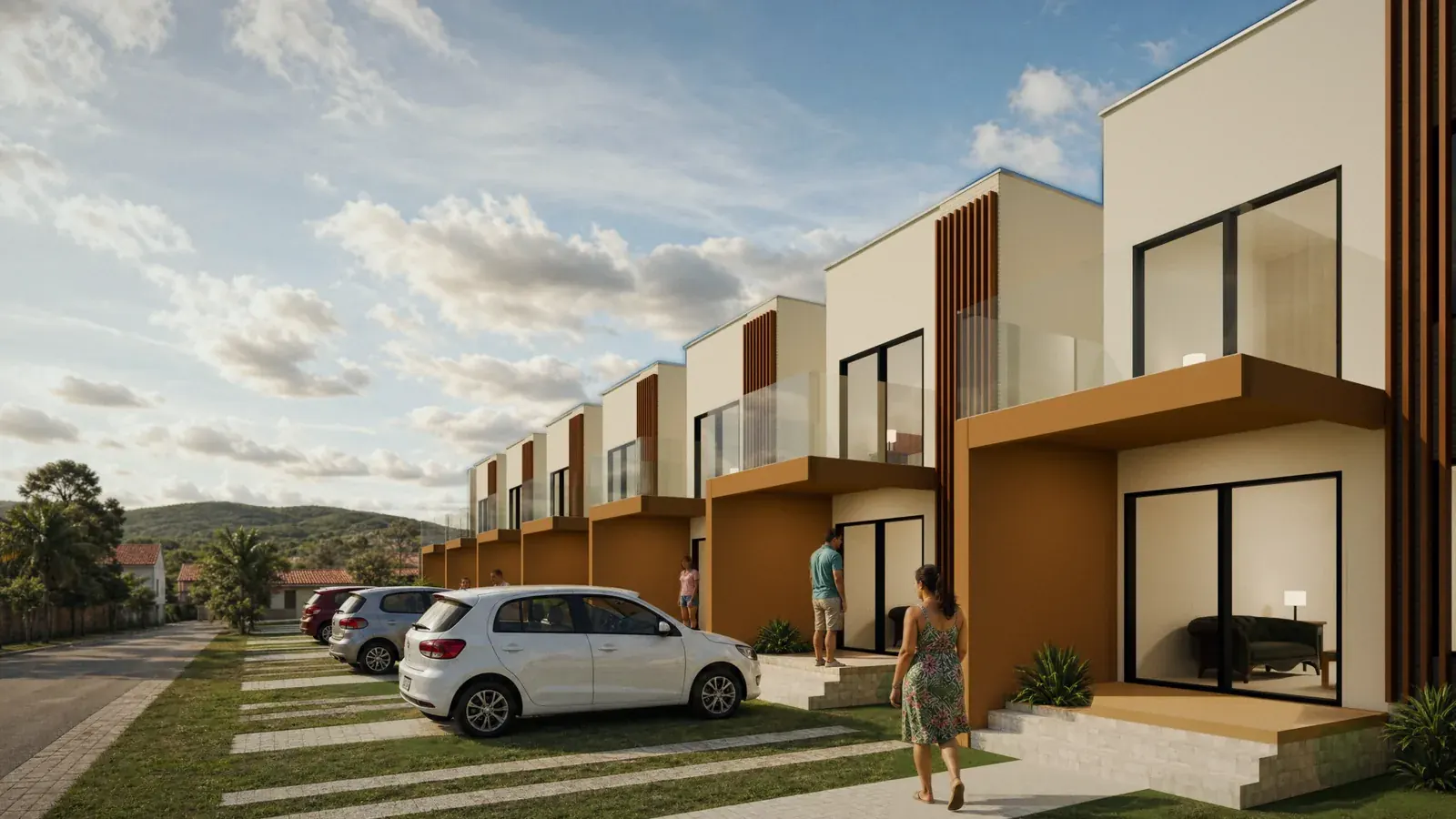 Fileira de casas de dois andares com paredes claras, detalhes em madeira e varanda de vidro, com carros estacionados na frente e céu azul com nuvens.